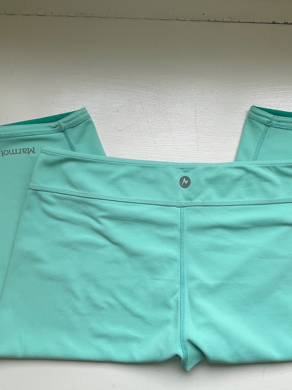 Mint green REVERSES to teal green Marmot capri.